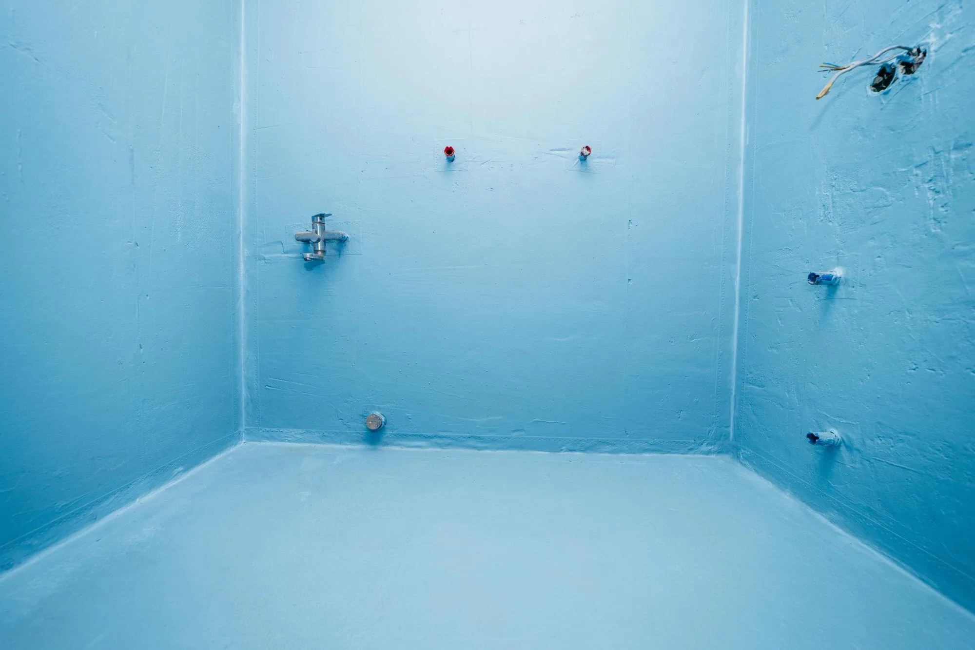 Empty shower enclosure prepared with waterproofing